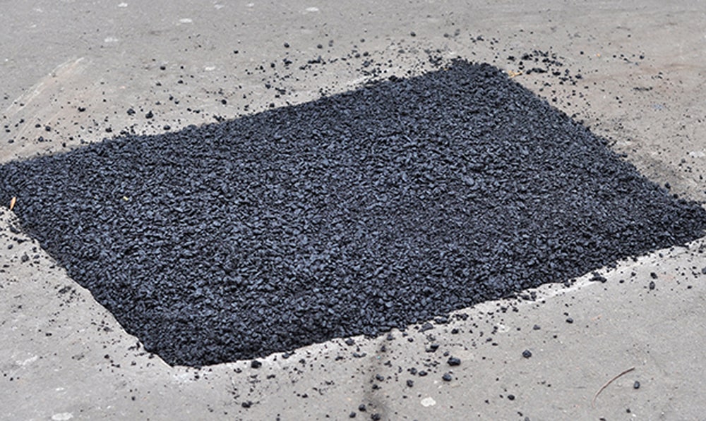 Patched section of asphalt