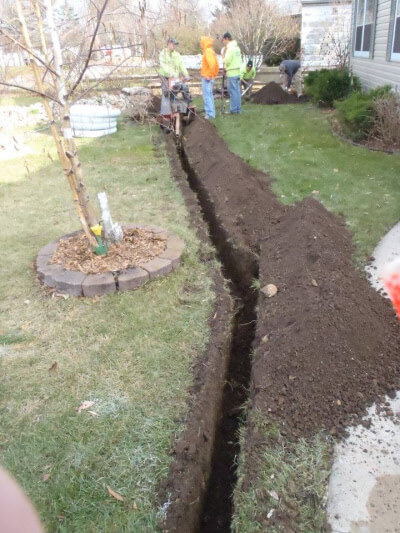Milwaukee drainage experts prepping the yard for new drain pipes