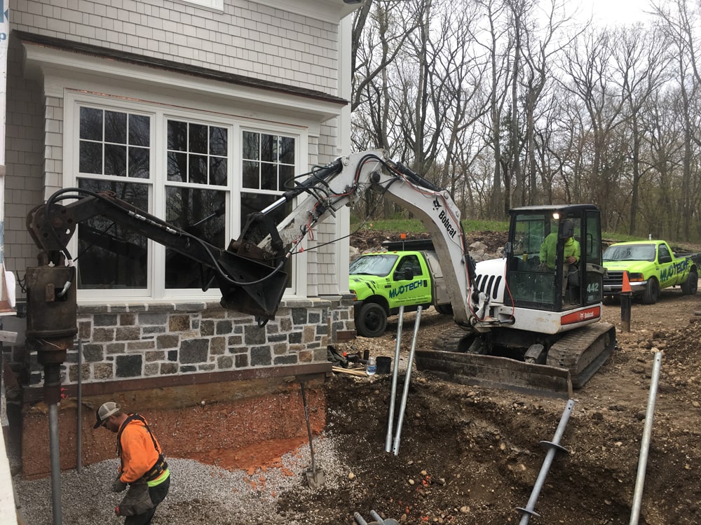 Excavation work on foundation of home.