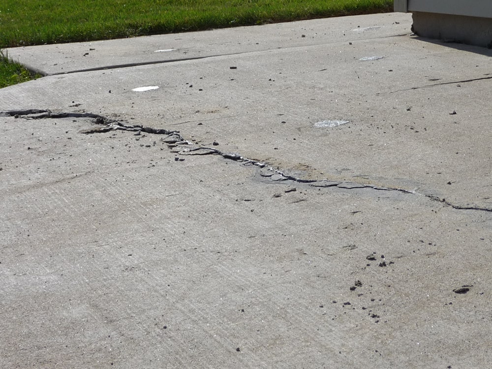 MudTech repairs and replaces cracked and damaged concrete at homes and businesses throughout southeast Wisconsin. Cracked concrete driveway