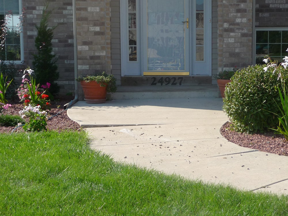 Level concrete sidewalk after mudjacking